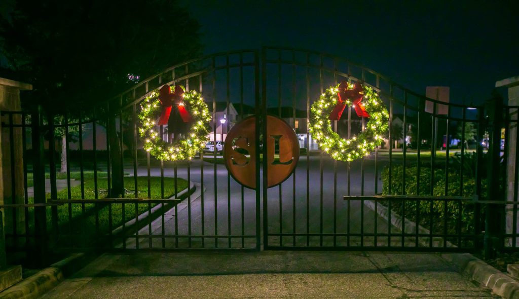 Entrance gate with lit wreaths